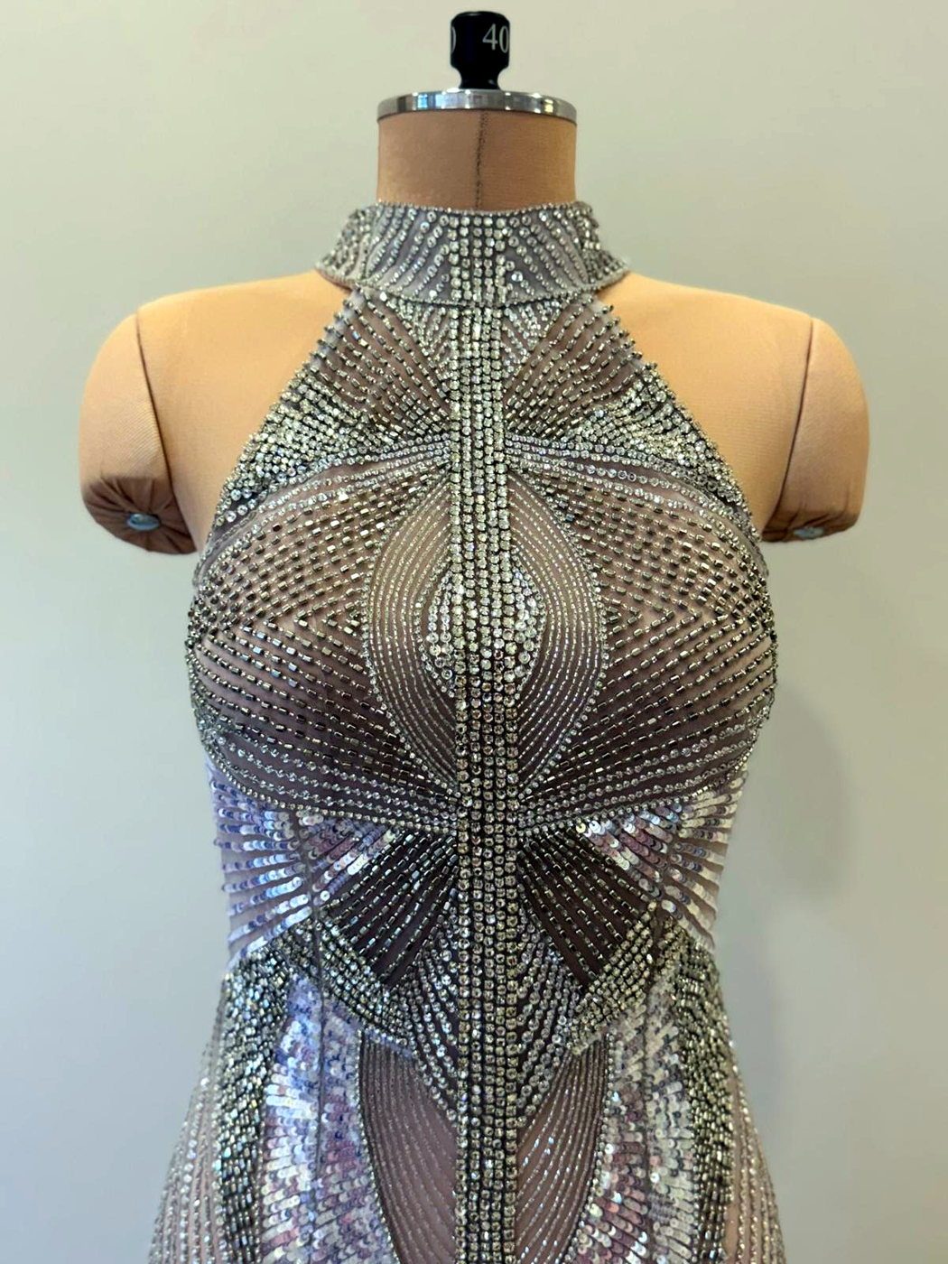 A crystal and sequin evening bodice, fully beaded in an Art-Deco fan pattern, on the stand