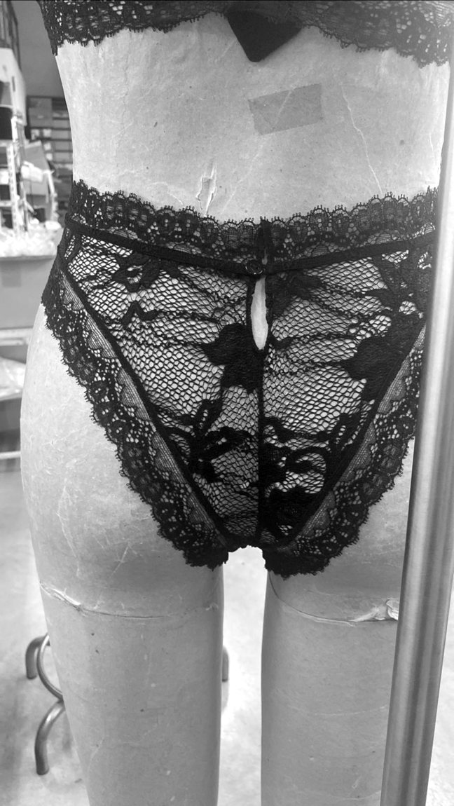 A high-waisted lace brief with lace trim, on the form