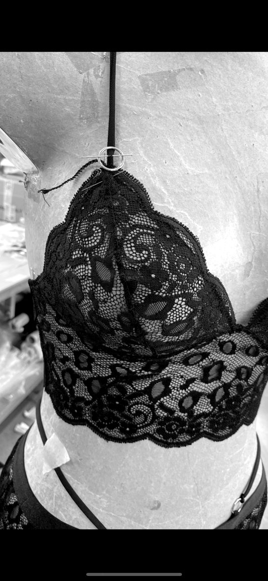 A lace bralette, on the form