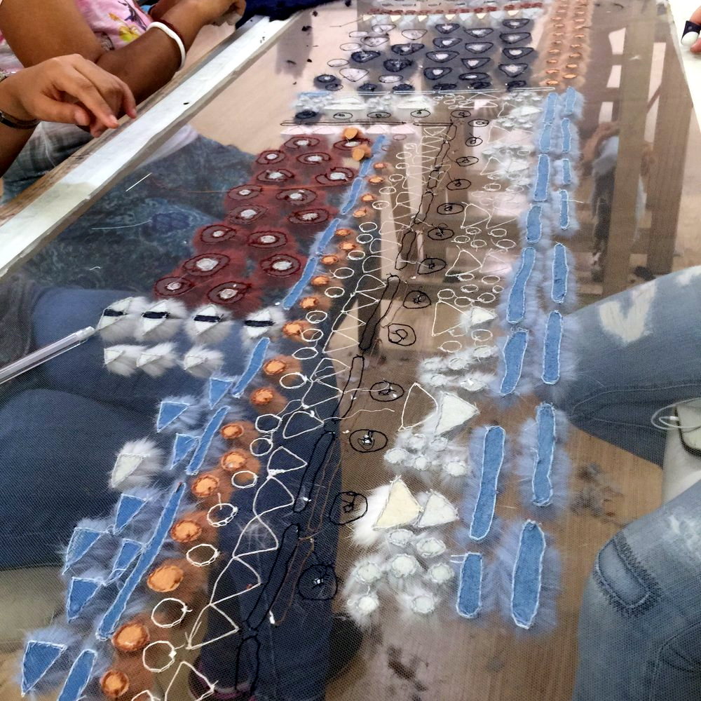 Bead and thread embroidery worked on a stretched denim frame