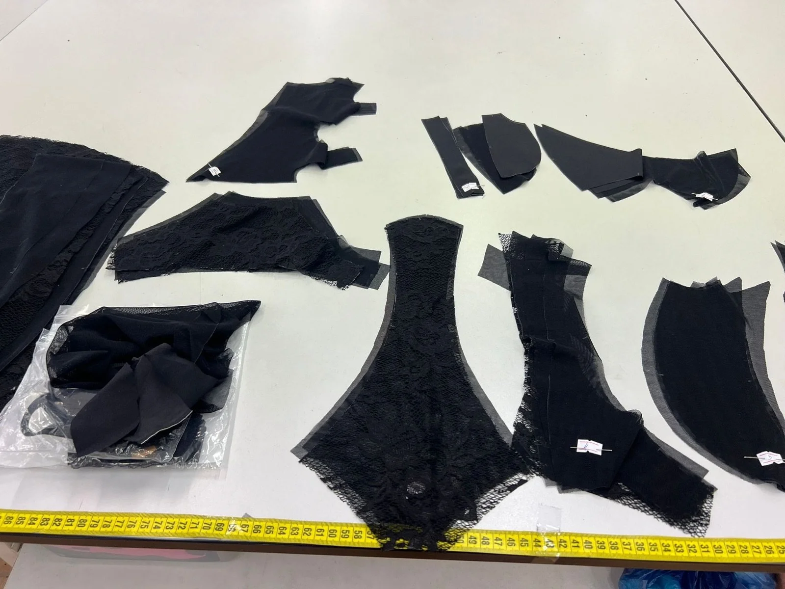 Couture pattern pieces laid out on the cutting table