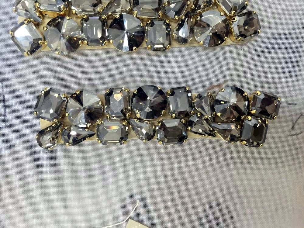 Rows of hand-set grey crystal stone trim on tulle