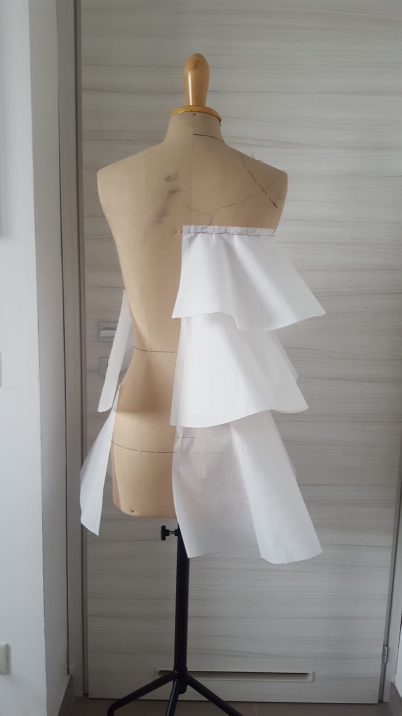 First paper tiers pinned to the mannequin