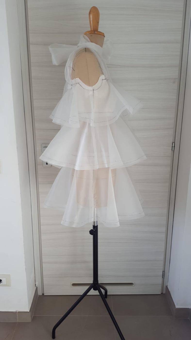 Completed paper moulage with neck bow on the mannequin