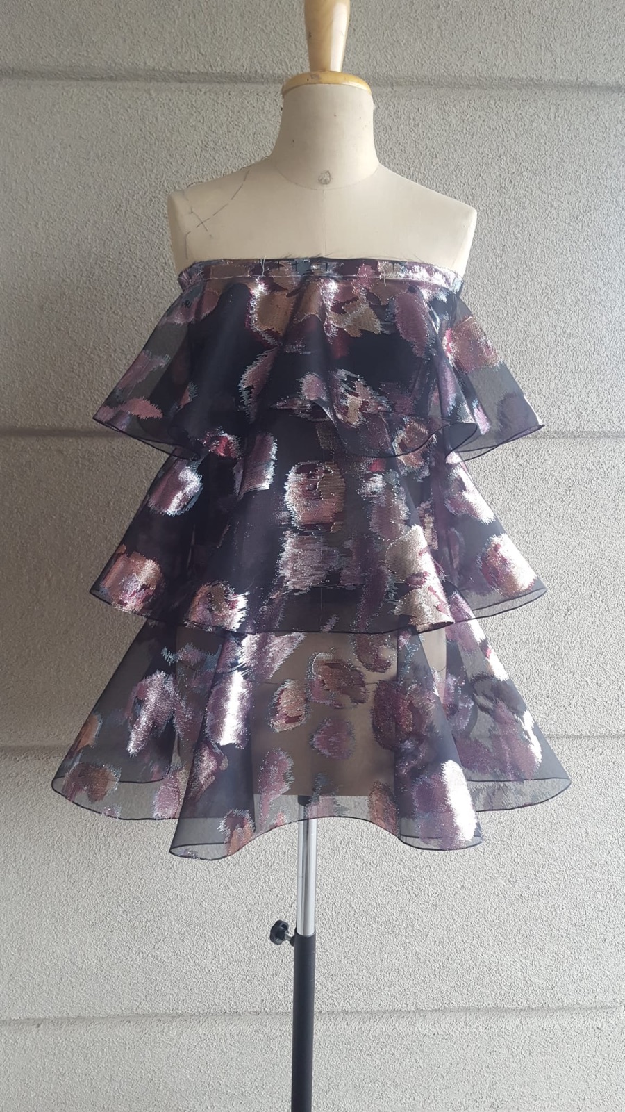 Finished tiered dress sewn in metallic fil coup&eacute; organza on the mannequin