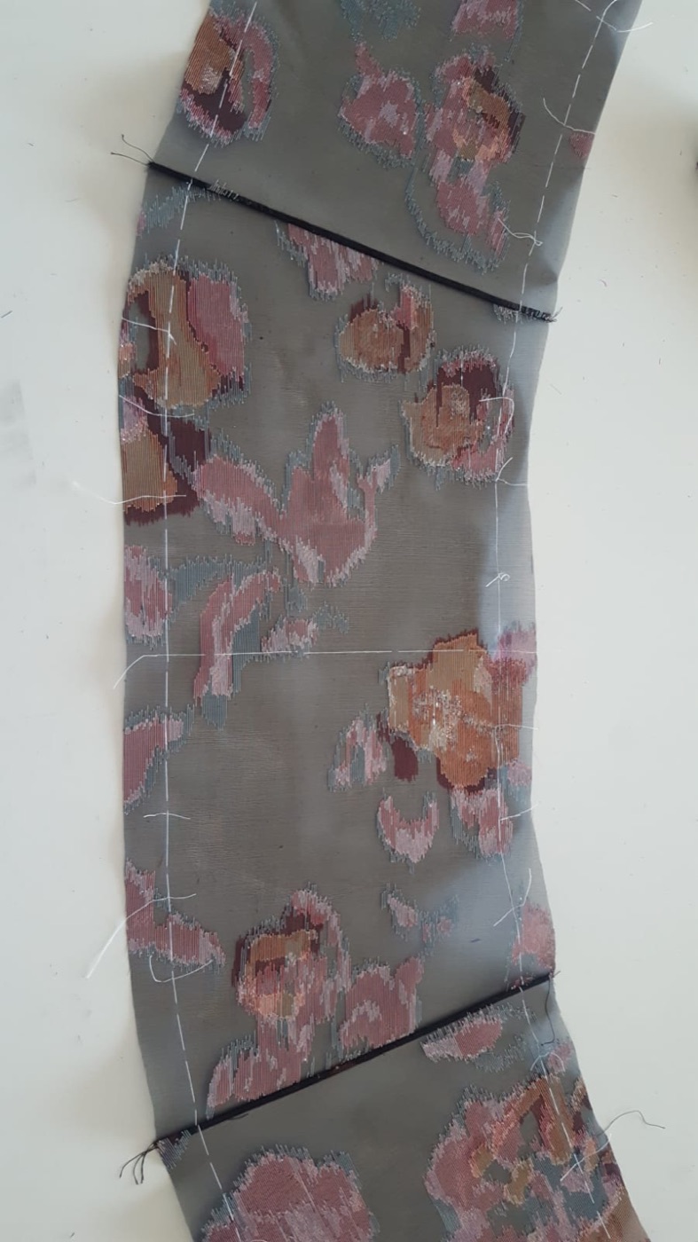 Cut panel marked with thread tracing